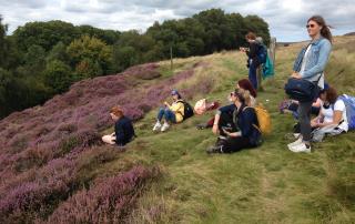 Campers sitting among heather